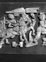 fragments from a carved set, showing human & animal figs., 5th section from left