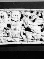 carved 'plaque', showing human figures