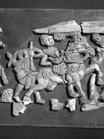 fragments from a carved set, showing human & animal figs., 4th section from left