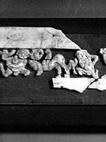 fragments from a carved set, showing human & animal figs., 3rd section from left